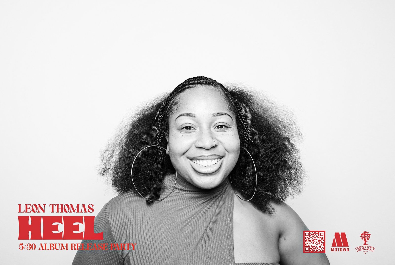 Guests posing at Leon Thomas HEÉL album release photo booth