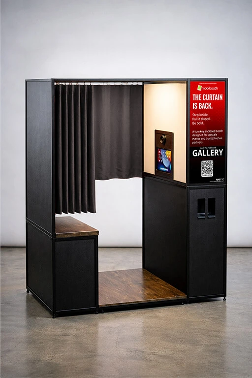 Enclosed photo booth with curtains.